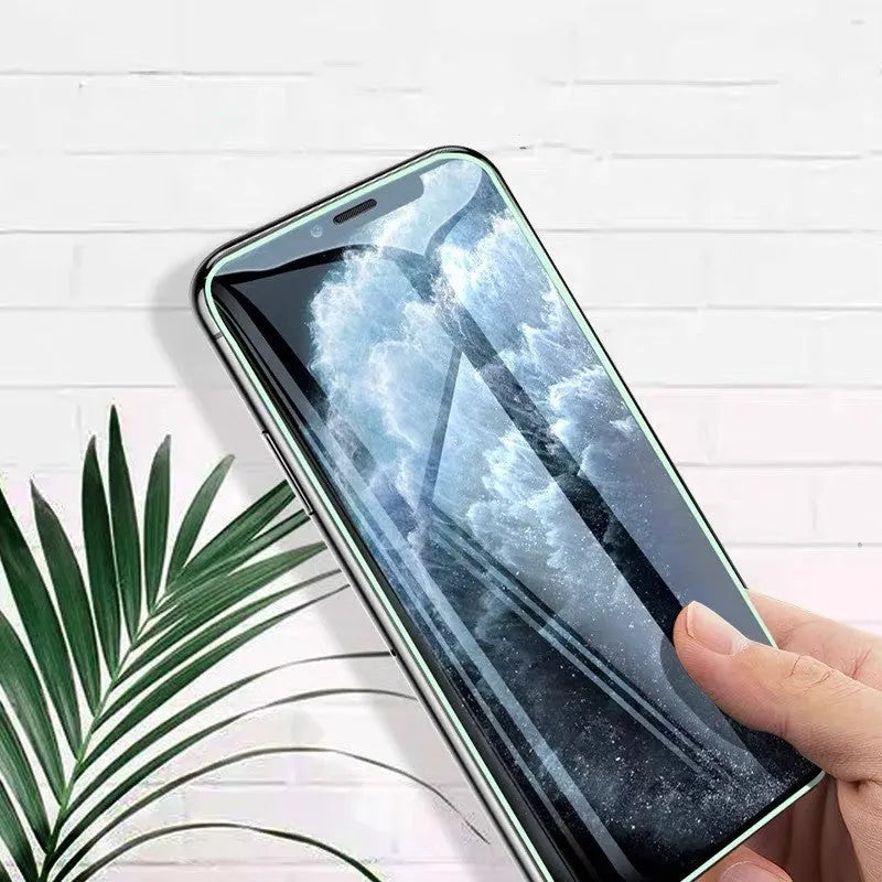 Luminous full cover tempered glass screen protector for iPhone glowing in the dark.