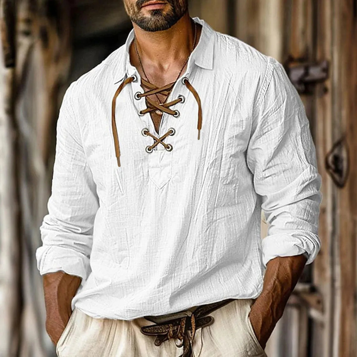 Men's loose fit long sleeve linen blend shirt in blue with a lapel collar, laid flat.