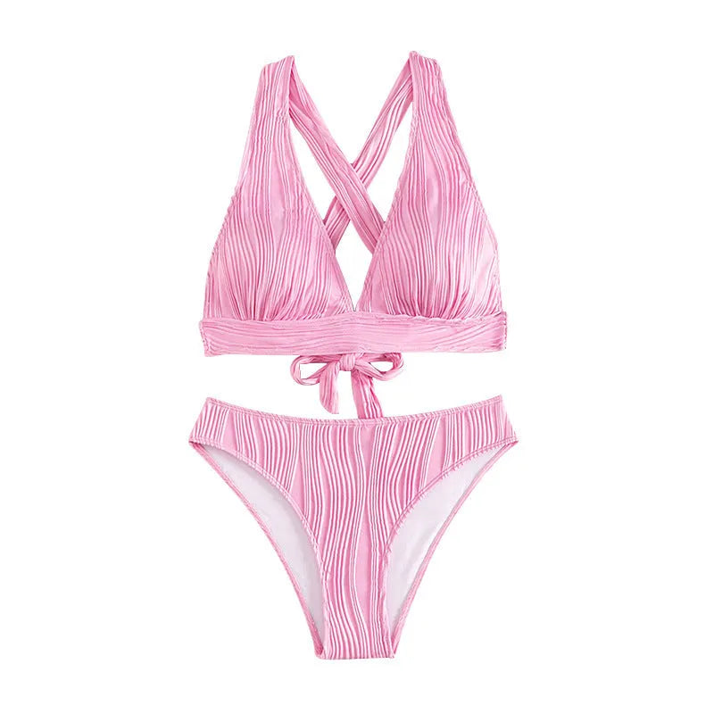 Women's pink halter strap bikini set with matching shorts on mannequin