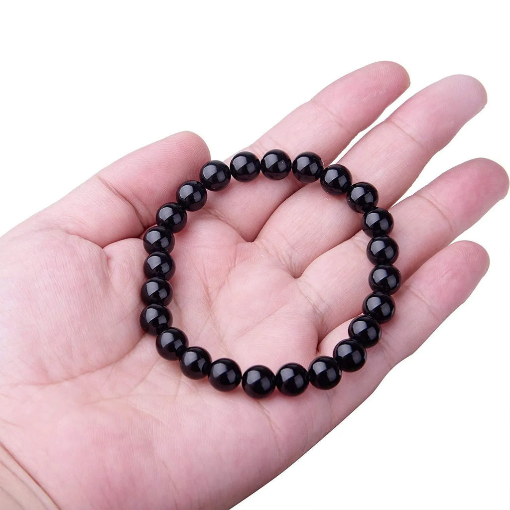 Geometric black onyx bead bracelet for women with elastic cord.