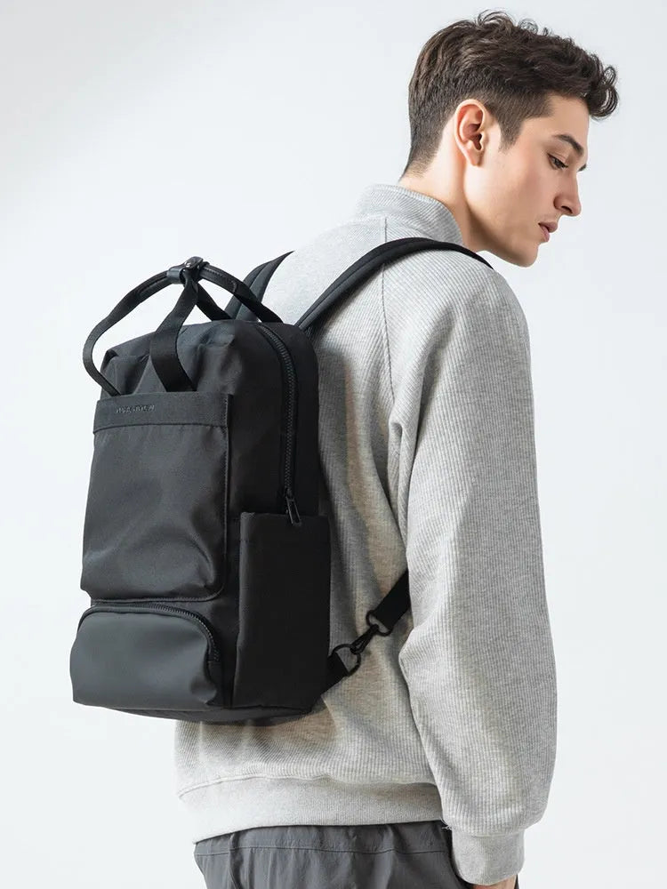 Black lightweight Oxford cloth computer backpack showing internal organisational compartments