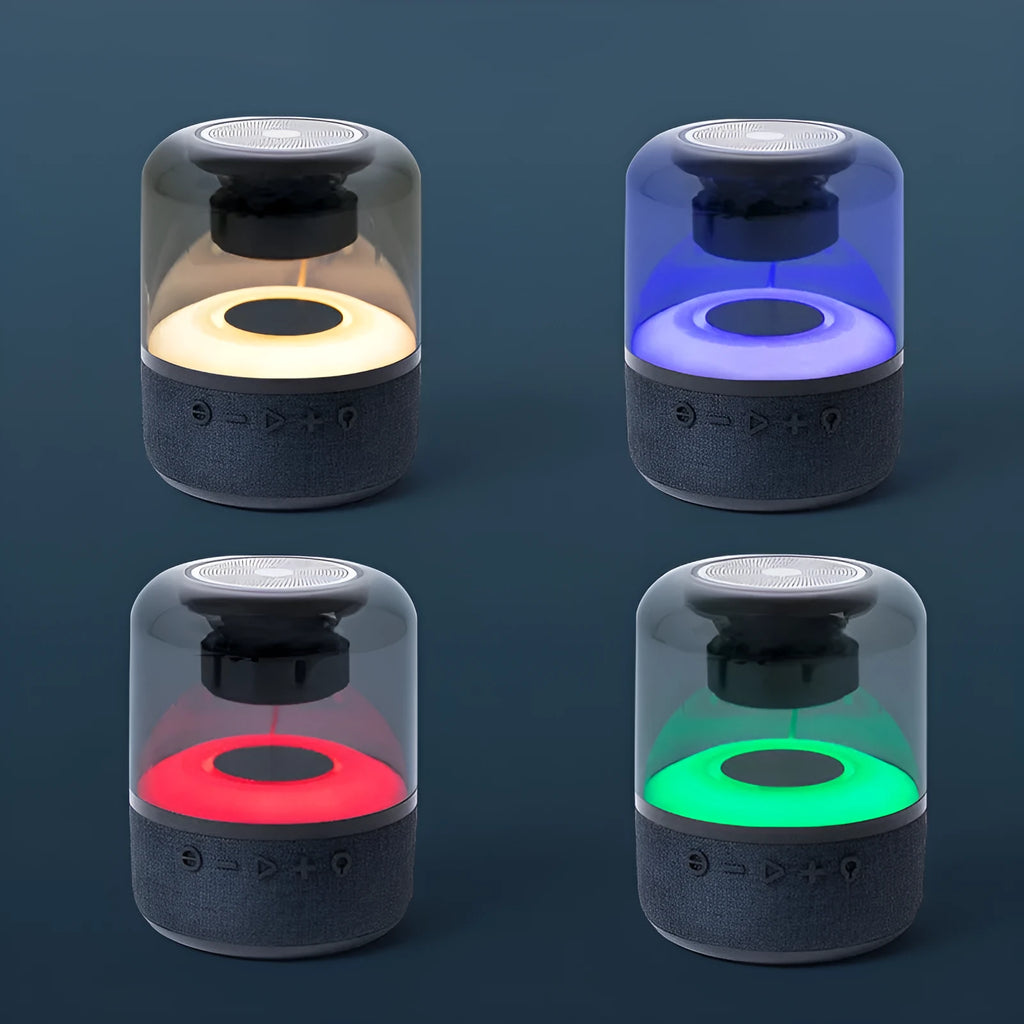 Black Four-Colour Light Touch Wireless Bluetooth Speaker with illuminated controls on a dark surface.