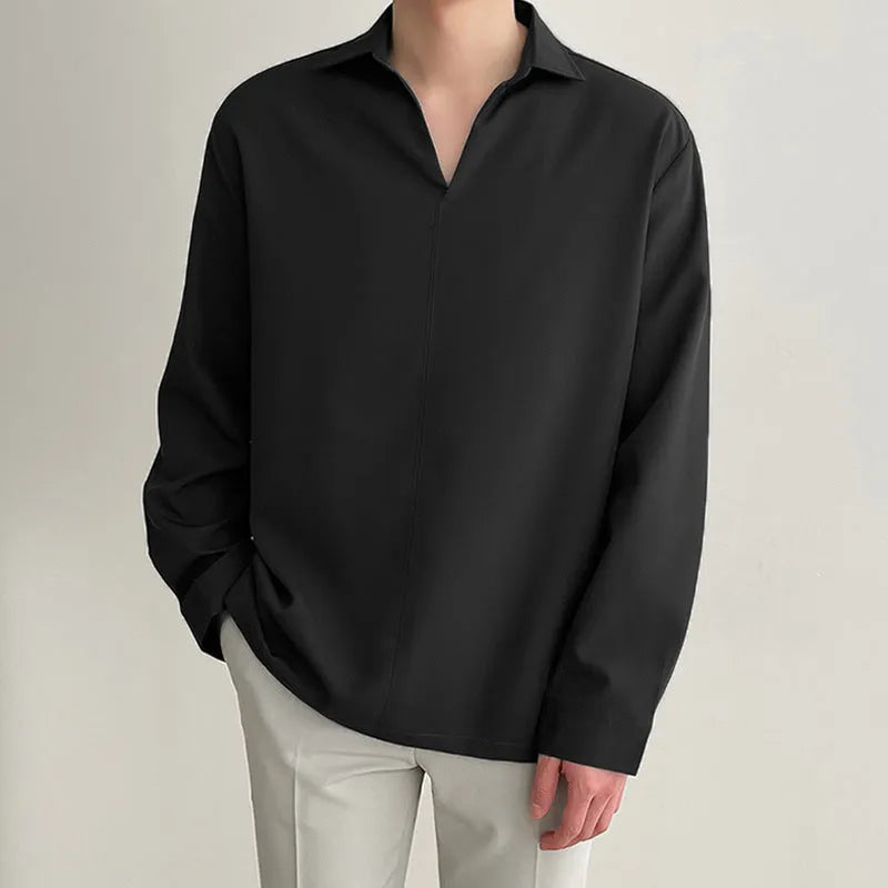 Man wearing loose fit long sleeve pullover shirt in solid colour for work casual wear