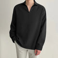 Man wearing loose fit long sleeve pullover shirt in solid colour for work casual wear