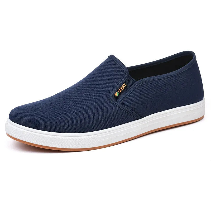 Men's black low-top canvas slip-on shoes with round toe and composite sole