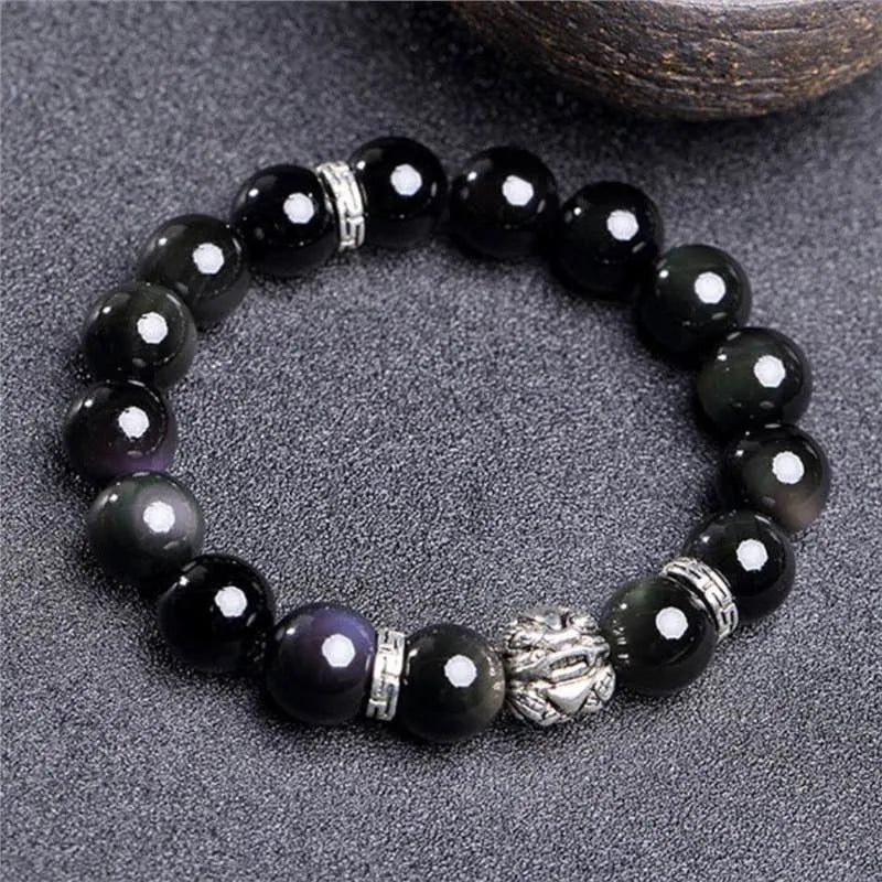 A silver and black obsidian bead bracelet showing lucky colour eye pattern, displayed in two sizes.