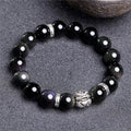 A silver and black obsidian bead bracelet showing lucky colour eye pattern, displayed in two sizes.