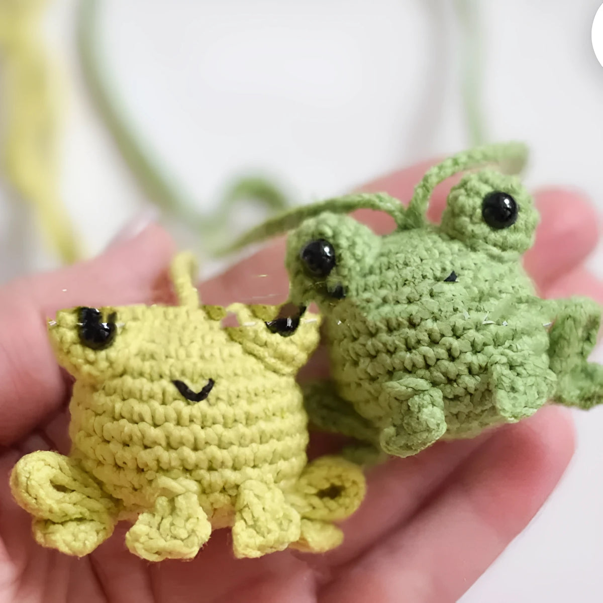 Handmade woven frog car pendant in plush materials measuring 15cm long