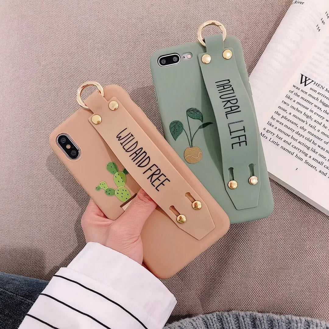 Green graffiti design iPhone wristband case with adjustable silicone strap attached to an iPhone model.