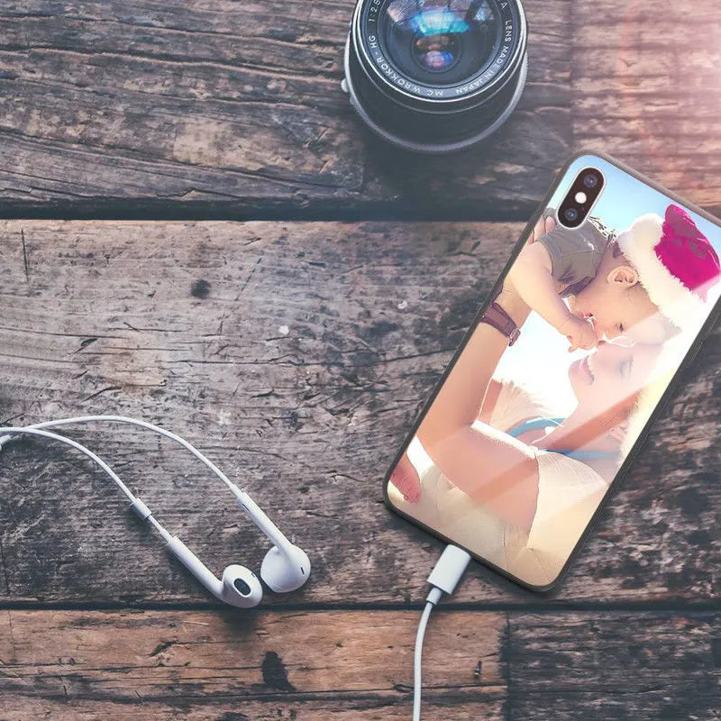 Slim patterned iPhone case with raised edges protecting a smartphone.