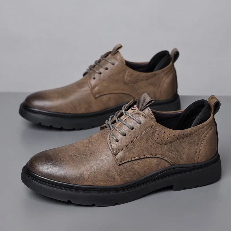 Men's black and brown leather casual shoes with a cowhide upper and rubber sole.