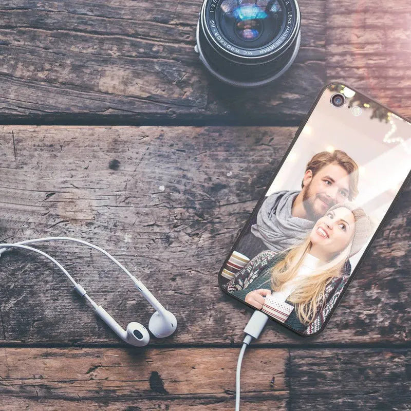 Slim patterned iPhone case with raised edges protecting a smartphone.