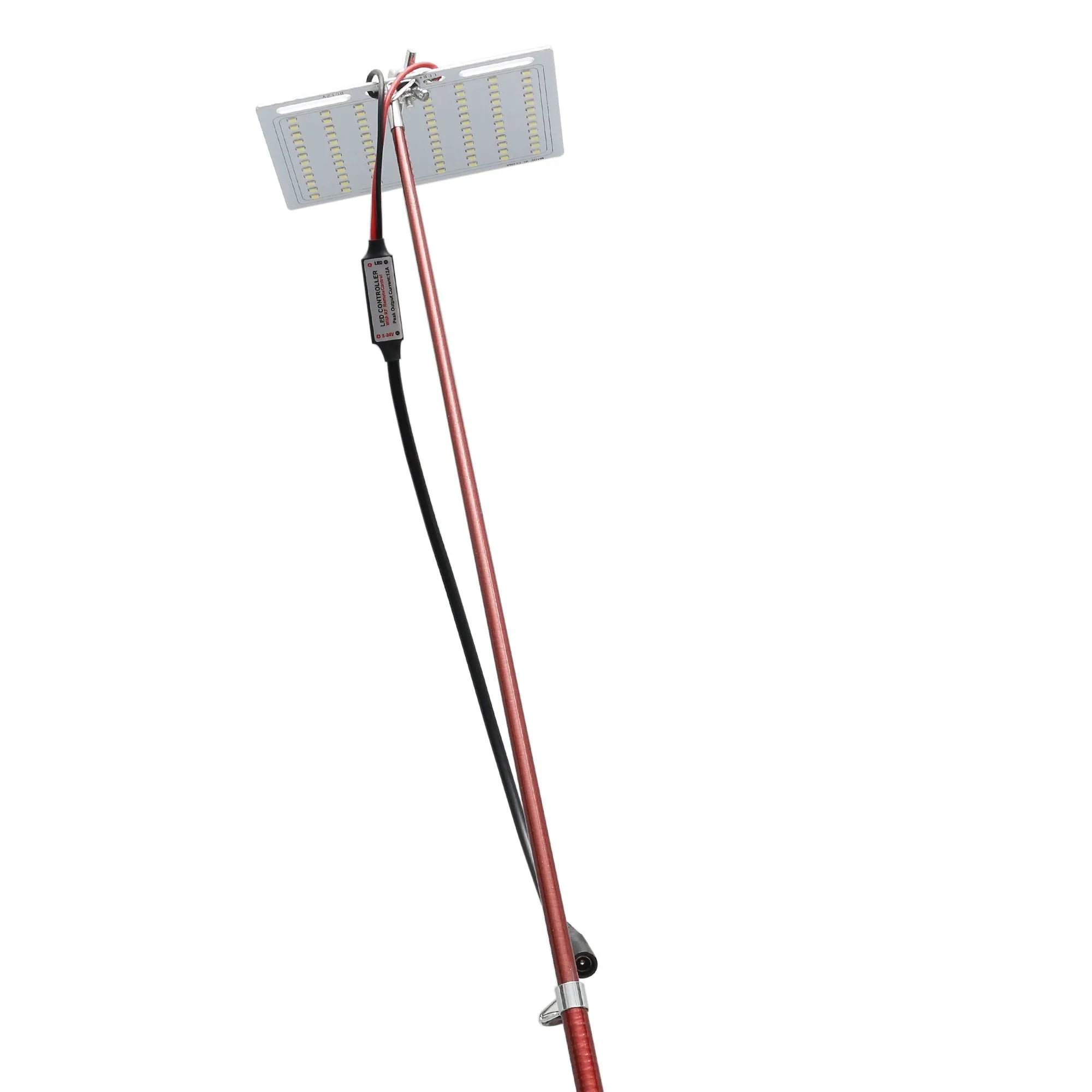 White LED fishing rod light unit mounted on top of an extended telescopic pole, with an RF remote control beside it.