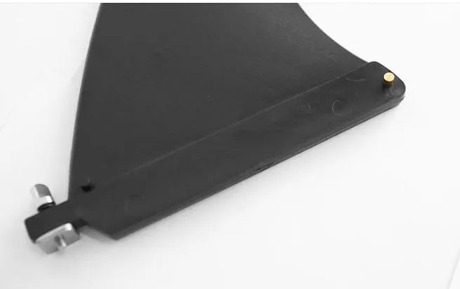 SUP paddle with large removable plastic fish fins attached via screw mechanism.