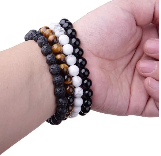 Geometric black onyx bead bracelet for women with elastic cord.