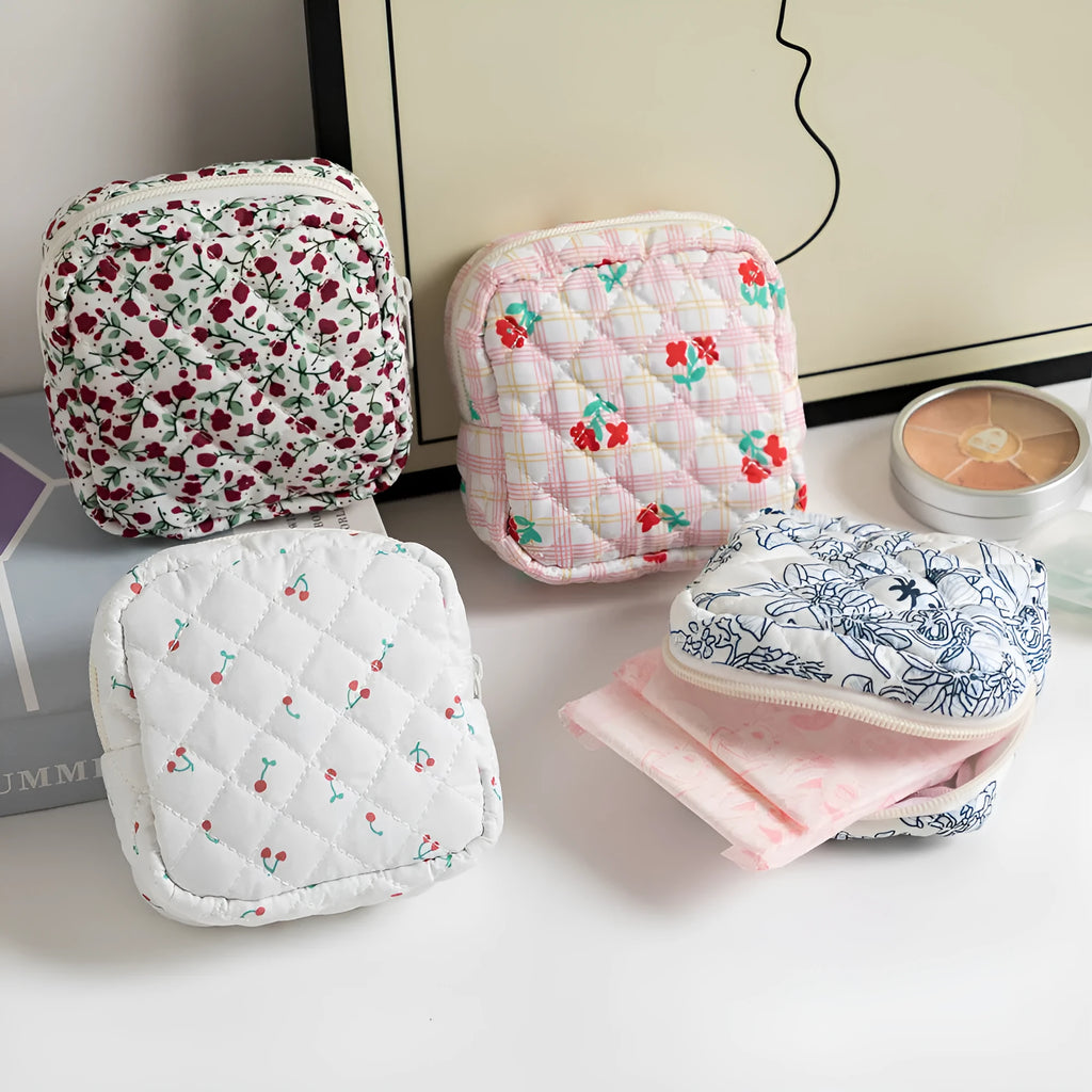 Polyester key storage wallet with floral or cherry print and sewing thread detail.
