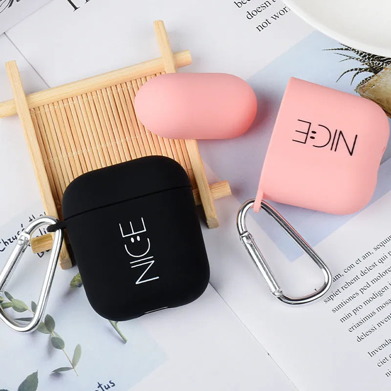 Black and Pink Apple AirPods silicone covers with Flower, Smiley, and Love designs.
