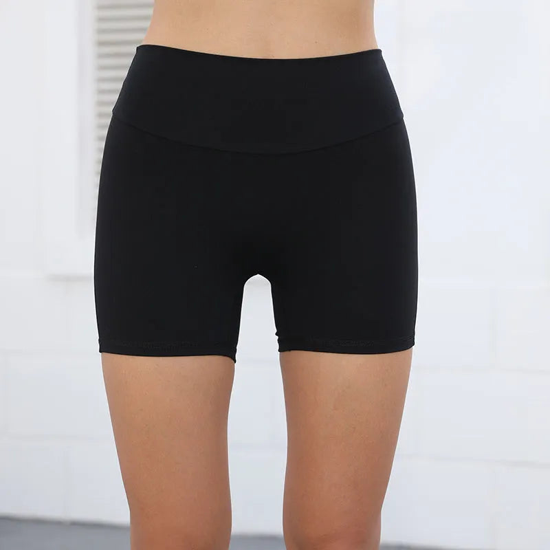 Women's high waist hip lifting shorts with pockets in various colours for fitness activities