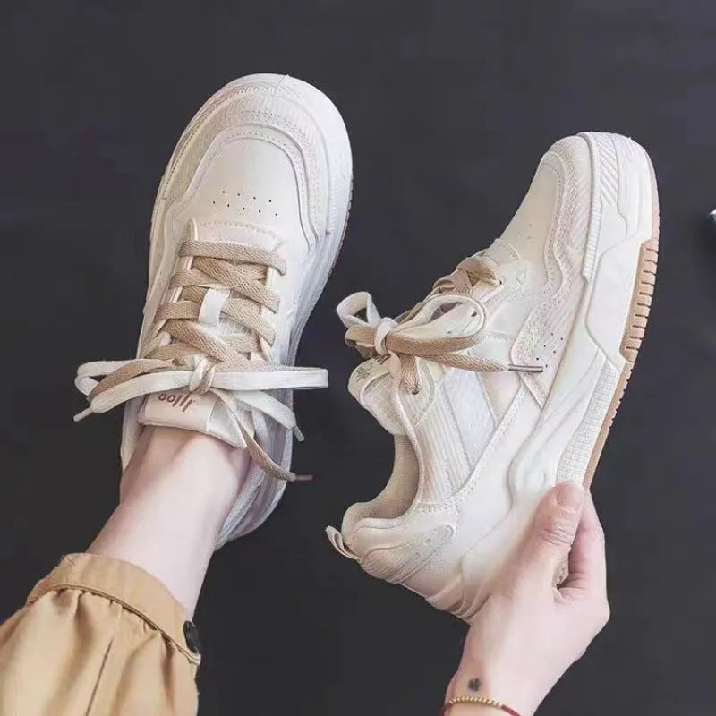 Women's pink and white height increasing rubber sneakers with low-top design