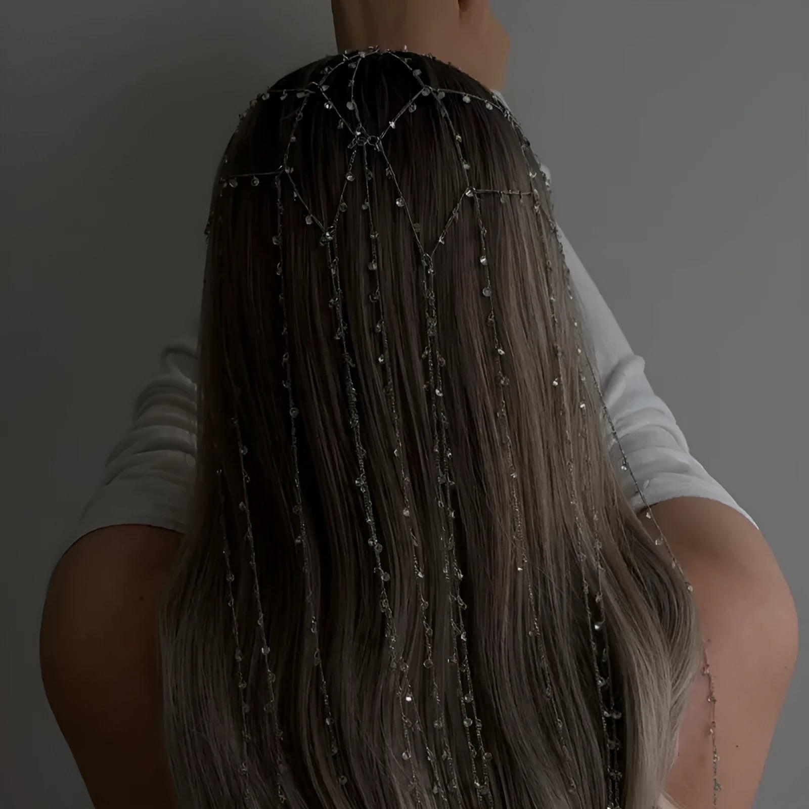 Gold and silver rhinestone mesh hair band with a tassel detail