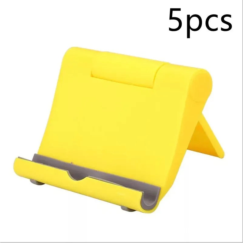 Black PE folding tablet stand holding a mobile phone at an adjustable angle