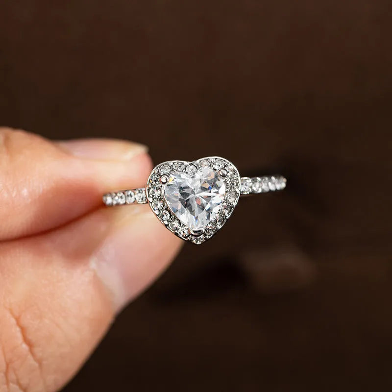 Heart-shaped crystal wedding ring with electroplated rose gold or silver finish on white copper