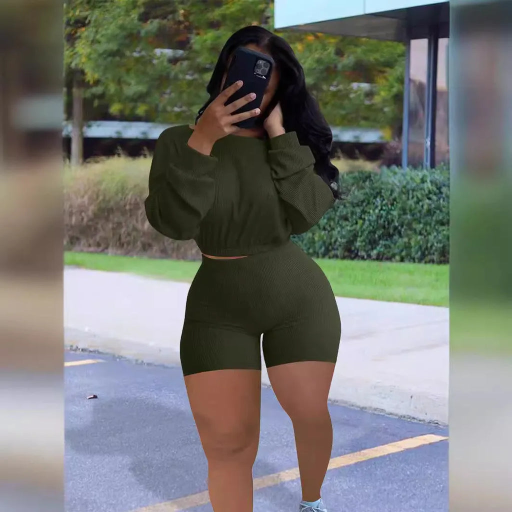 Women's off-shoulder two-piece set with long sleeves and matching shorts in solid colour