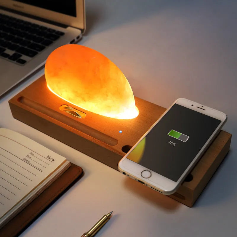 Sunrise Oriental wooden base salt lamp with wireless phone charging pad on top.