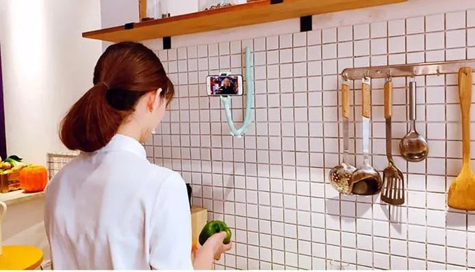 Black flexible lazy bracket phone holder extended to 62cm with suction cup mount showing 360° rotation mechanism