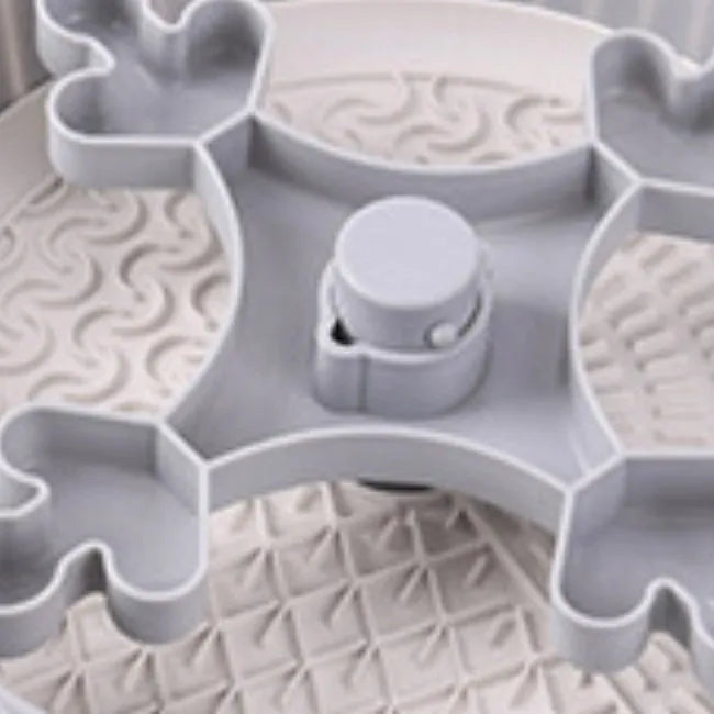 Pet slow feeder bowl with silicone licking mat in rotating game board design
