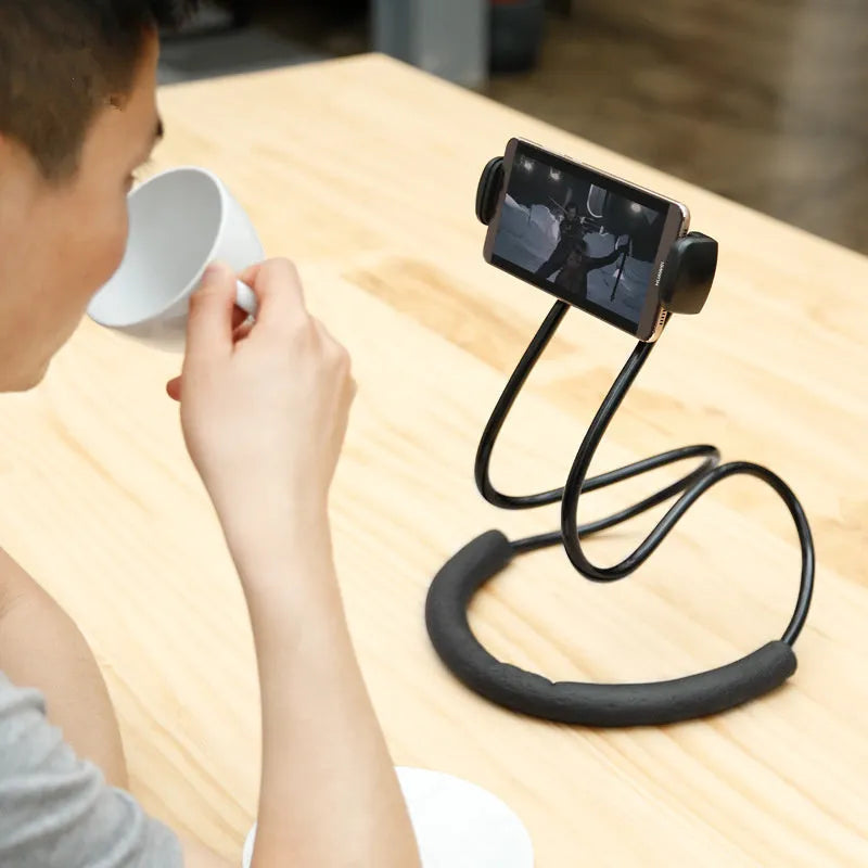 Baseus flexible gooseneck phone holder with clamp and shockproof support, shown holding a mobile phone.