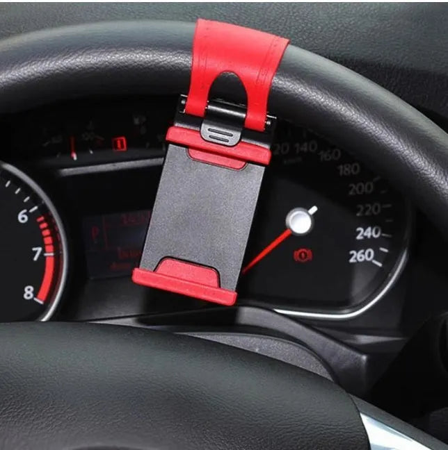 Black universal steering wheel phone holder clip for smartphones showing silicone pad