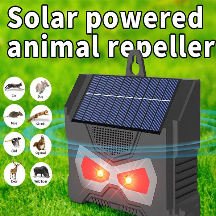 Black animal-shaped outdoor ultrasonic repeller with solar panel on top.