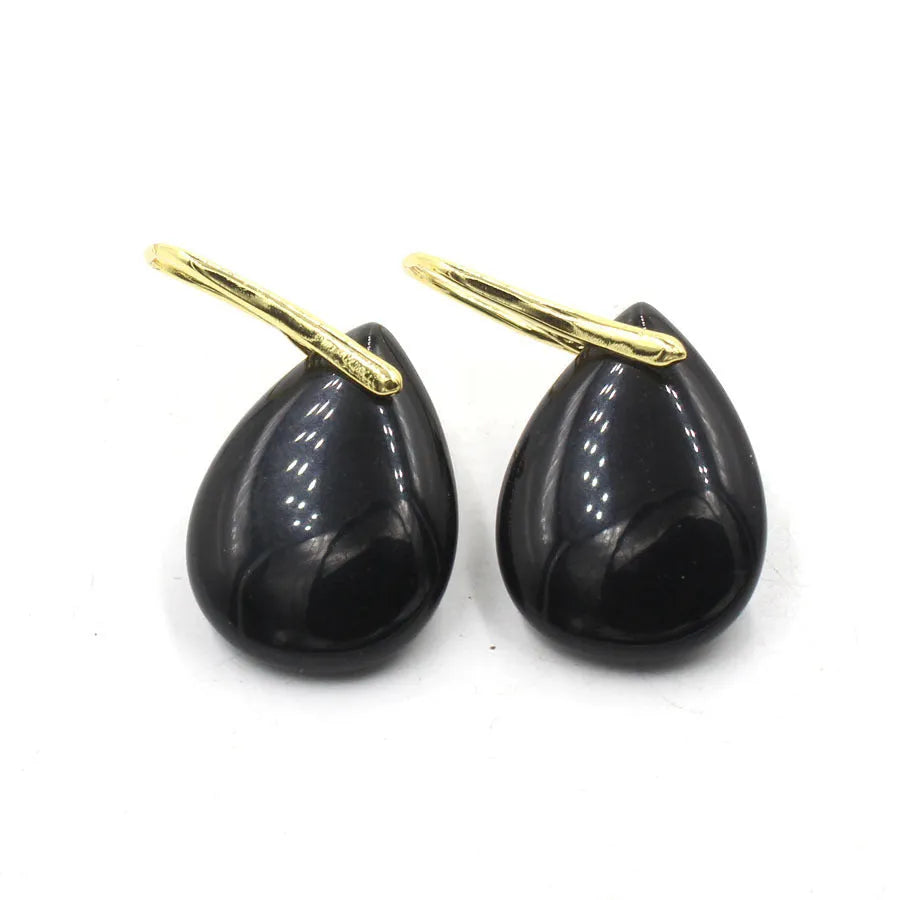 Geometric water drop earrings with electroplated settings holding genuine crystal stones in multiple colour options