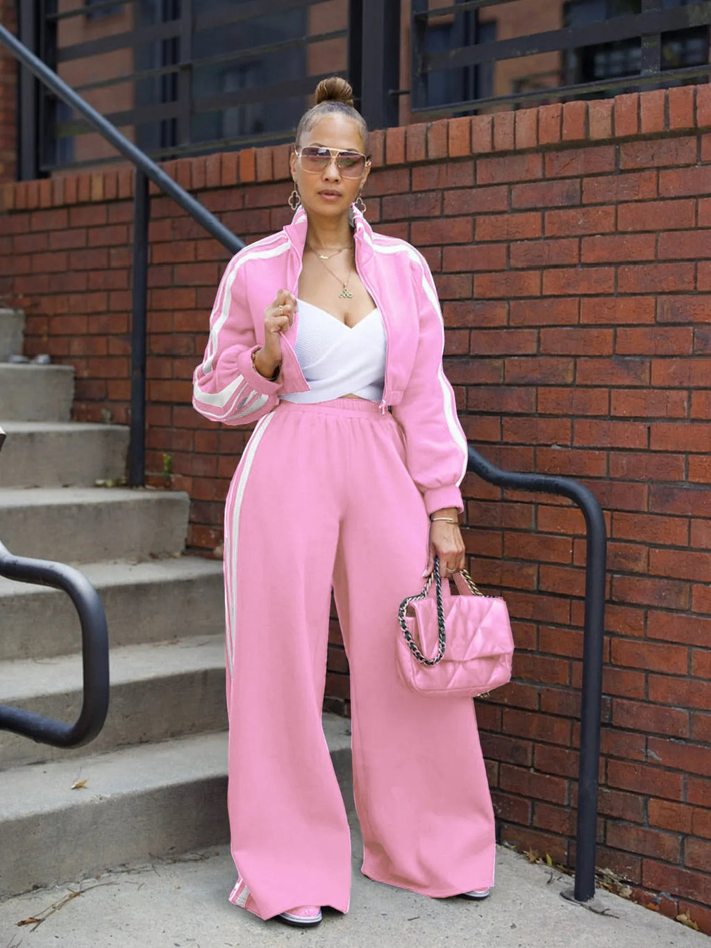 Two-piece casual suit set with zipper detailing and striped pattern in multiple colour options