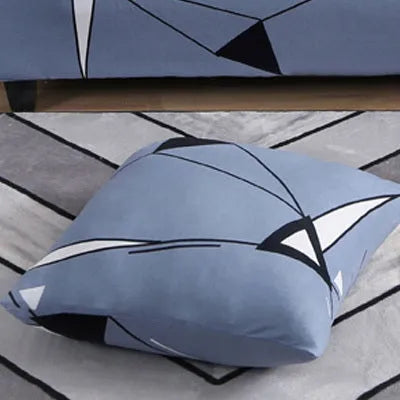 Geometric abstract print stretch sofa slipcover on a modern sofa