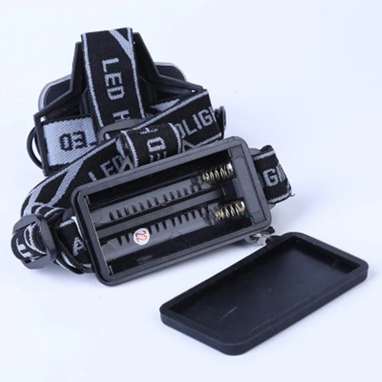 Outdoor head torch with adjustable strap and LED light providing long-range beam for camping