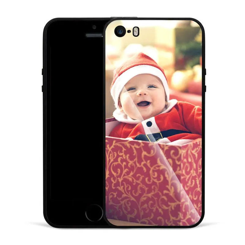 Slim patterned iPhone case with raised edges protecting a smartphone.