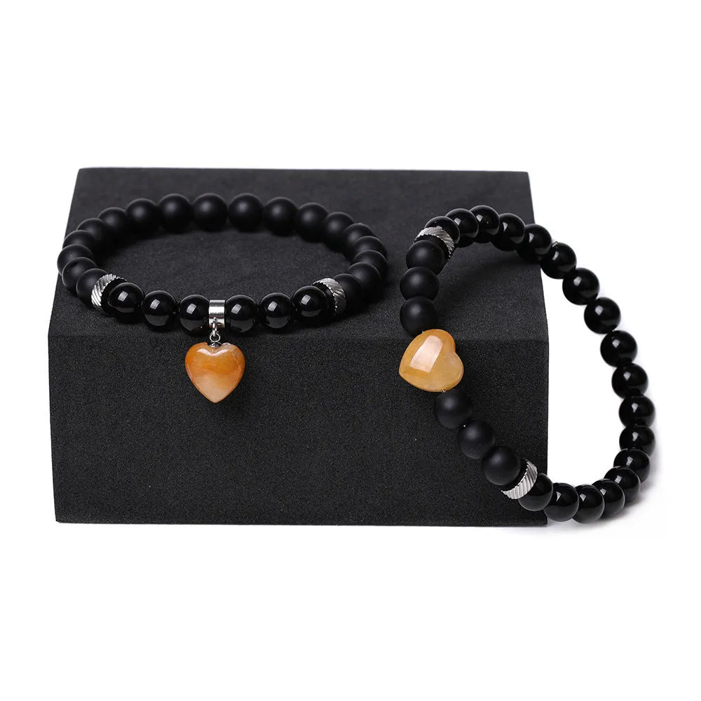 Polished natural stone couple heart bracelets in obsidian, agate, tigereye, crystal, aventurine, topaz, opal colours.