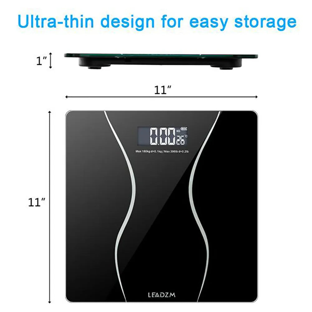 Black electronic bathroom scale with LCD display on a bathroom floor.