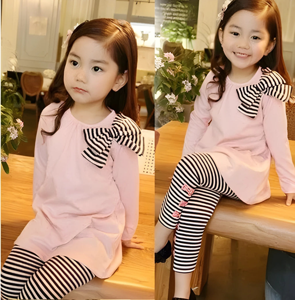 A pink cotton blend clothing set for a young girl, shown on a hanger.
