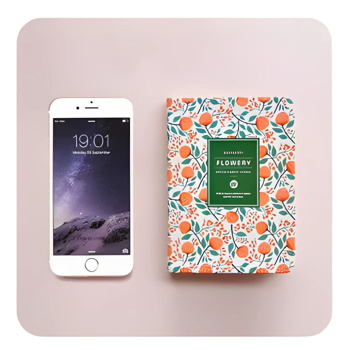 Green floral fabric imitation leather notepad with wireless binding lying open on a desk
