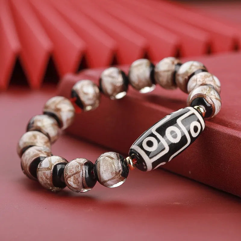 Close-up of a colourful Chinese snake year lucky bead bracelet made from hand-strung coloured glaze.