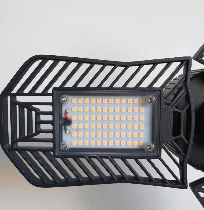 Waterproof industrial foldable garage LED flood light with aluminium housing in workshop setting