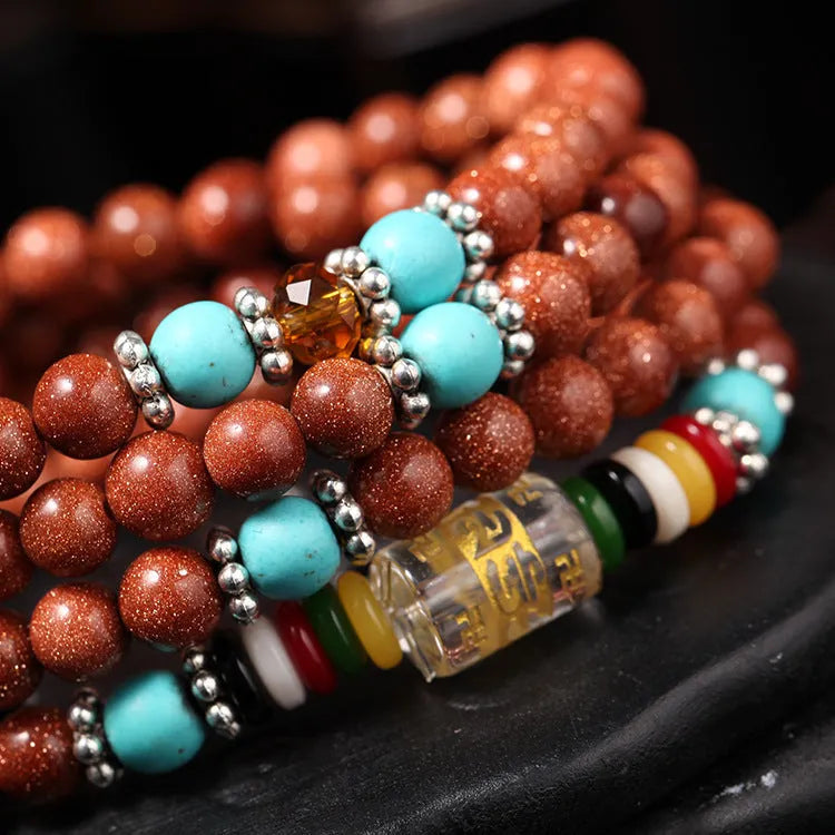Golden star stone colour bracelet with 108 nugget sand pieces and six words mantra design