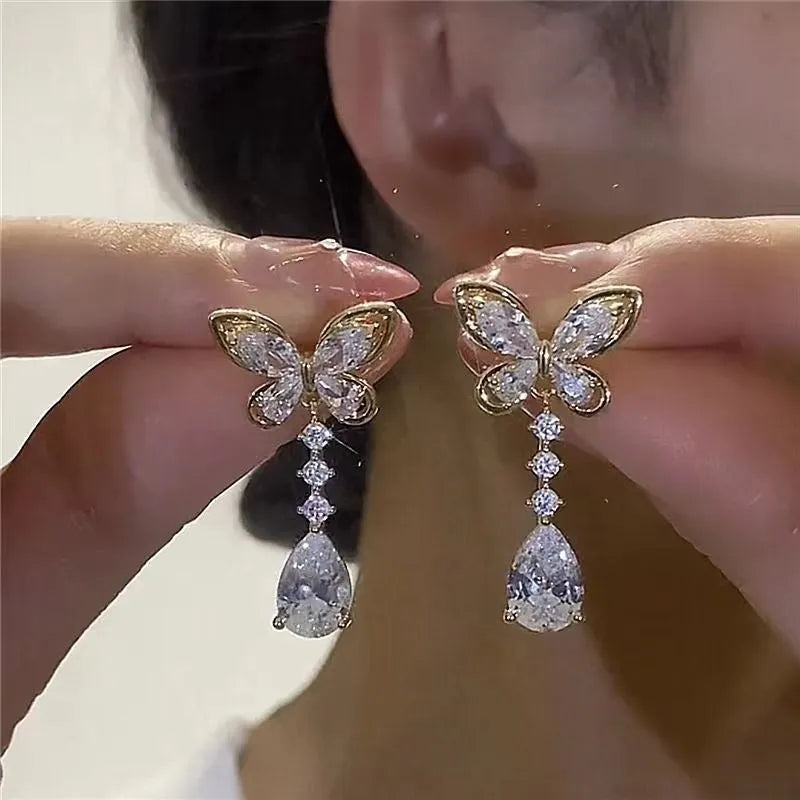 Platinum colour bow stud earrings with zinc alloy construction and electroplating treatment