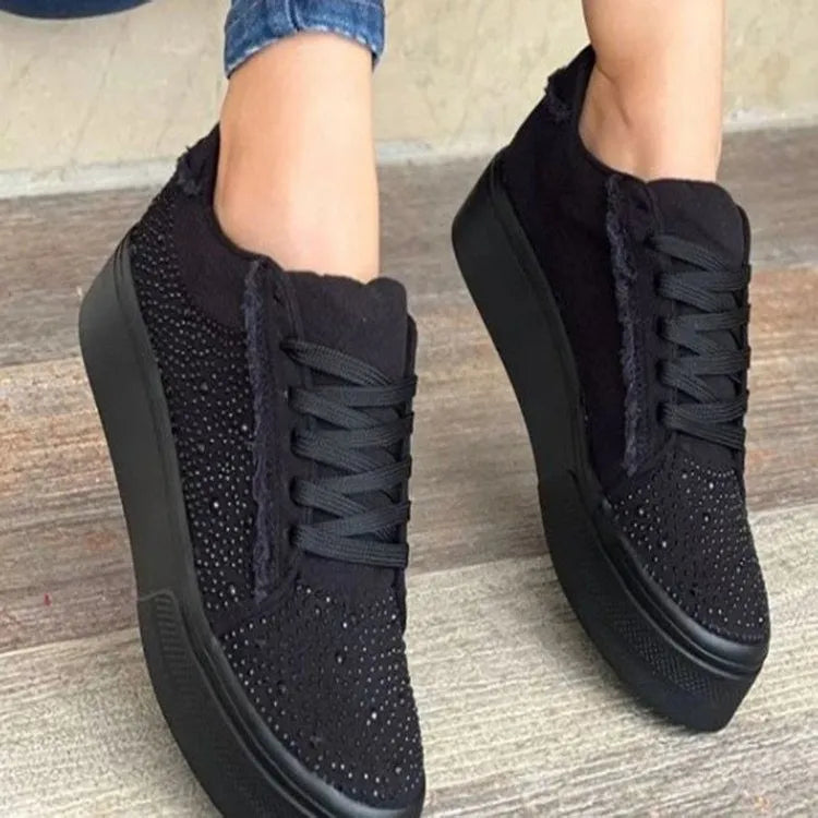 Plus size women's black lace-up casual shoes with rhinestones on the side and a thick rubber sole.