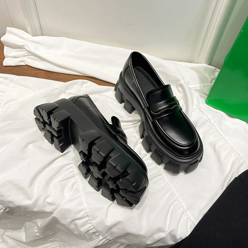 British style wide fit loafers in patent leather or matte finish with rubber sole.