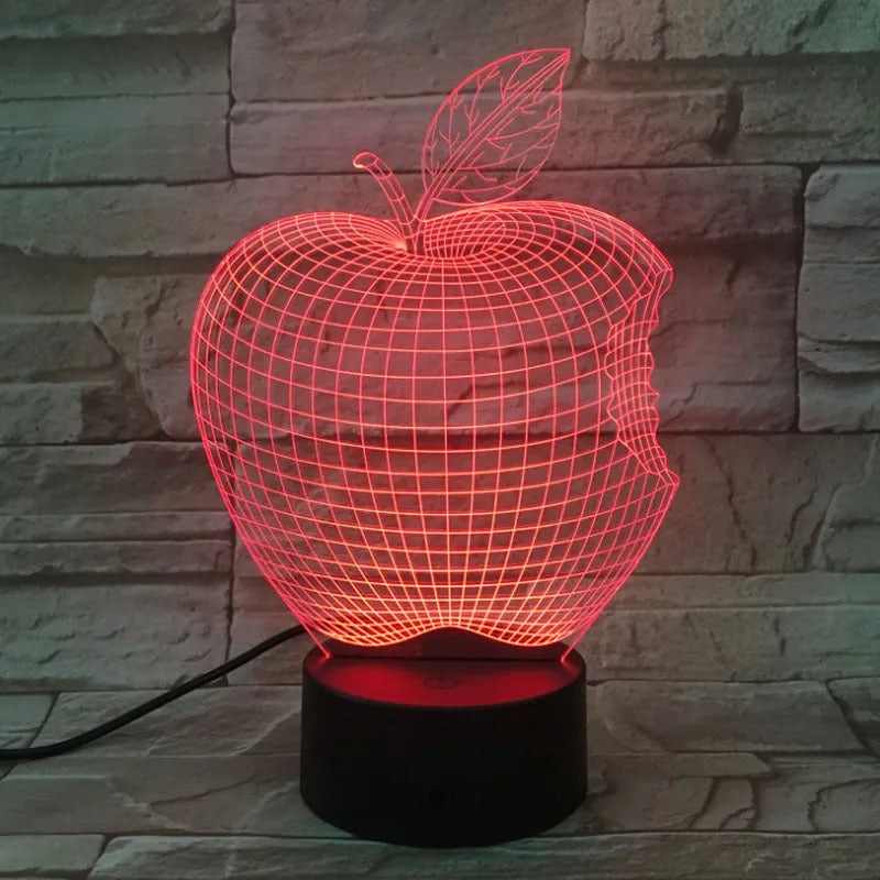 3D fruit-shaped decorative night light with colourful LED illumination on a table.