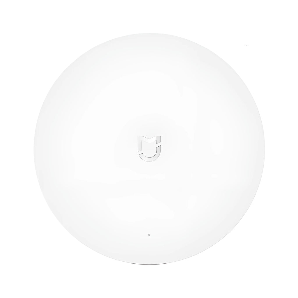 White circular Xiaomijia smart home gateway with UK plug, 90mm diameter wireless wall switch